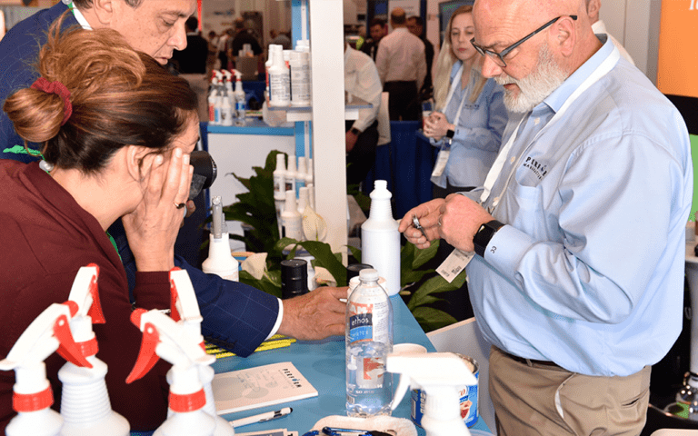 People Looking at Product on ISSA Show Expo Hall Floor