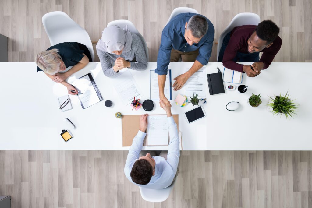 Corporate Recruiters Shaking Hand With Candidate